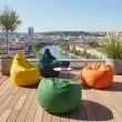 Gele zitzak poef